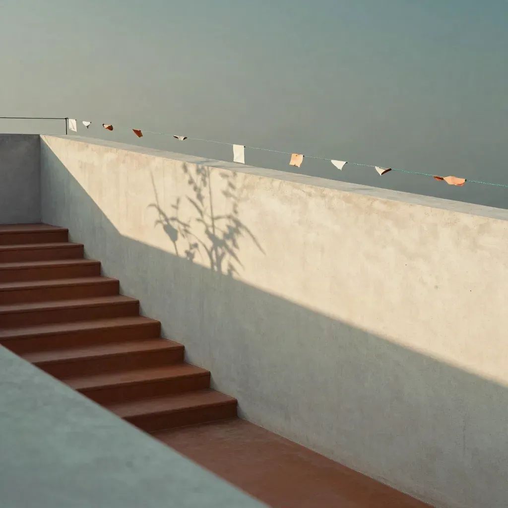 Sunlit rooftop courtyard with terracotta steps and fluttering paper flags